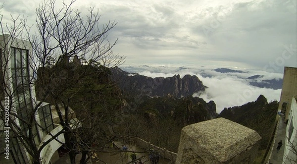 Fototapeta China Mount HuangShan - April, 2015: Natural scenery, sunsets, peculiarly-shaped granite peaks, Huangshan pine trees and views of the clouds from above. Photo taken in Yellow Mountain (UNESCO).