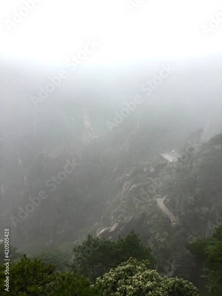 Fototapeta China Mount HuangShan - April, 2015: Natural scenery, sunsets, peculiarly-shaped granite peaks, Huangshan pine trees and views of the clouds from above. Photo taken in Yellow Mountain (UNESCO).
