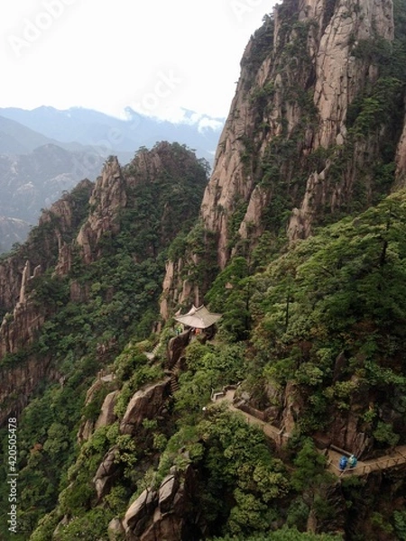 Fototapeta China Mount HuangShan - April, 2015: Natural scenery, sunsets, peculiarly-shaped granite peaks, Huangshan pine trees and views of the clouds from above. Photo taken in Yellow Mountain (UNESCO).