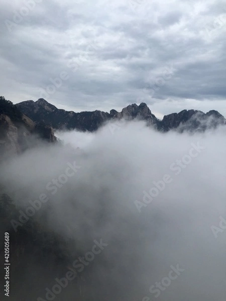 Fototapeta China Mount HuangShan - April, 2015: Natural scenery, sunsets, peculiarly-shaped granite peaks, Huangshan pine trees and views of the clouds from above. Photo taken in Yellow Mountain (UNESCO).