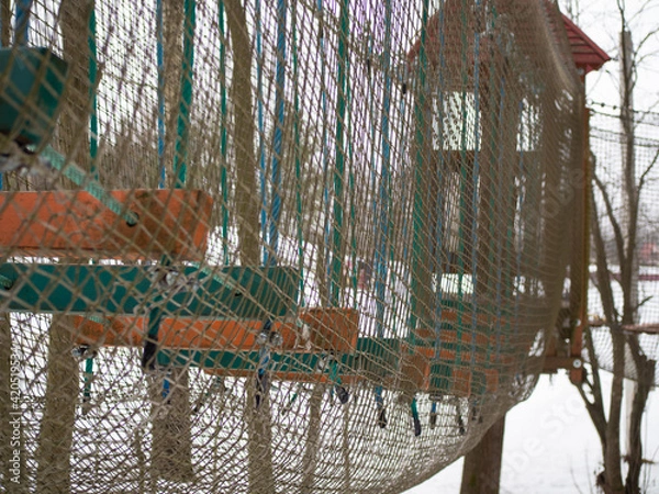 Obraz rope town. steps between trees with safety net