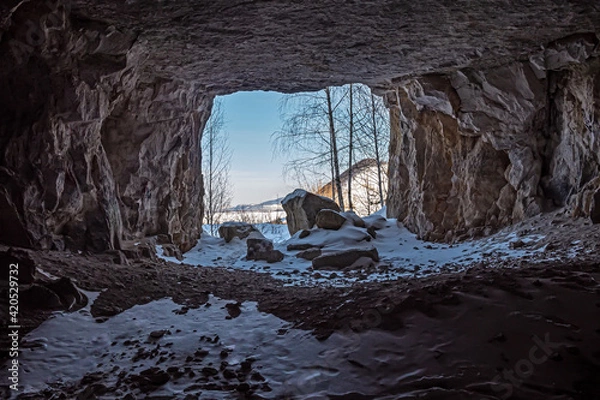 Obraz Exit from a mountain cave in winter