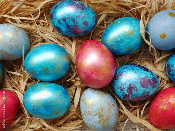 Fototapeta Easter flatlay with beautiful painted eggs. Concept of Easter egg hunt or egg decorating art