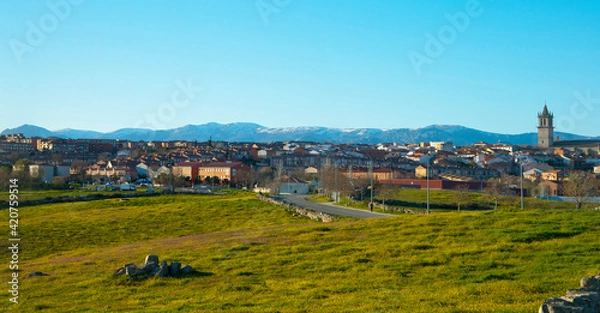 Fototapeta Colmenar Viejo skyline with the Guadarrama range snowy in the background