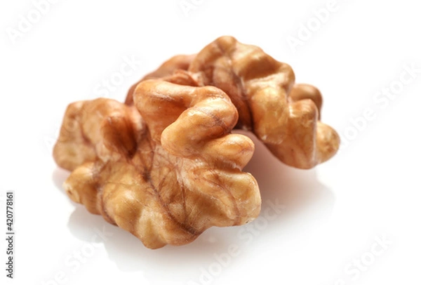 Fototapeta Single golden walnut kernel isolated on white
