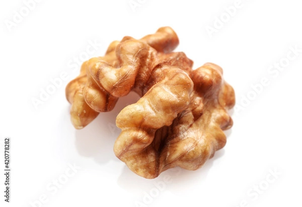 Fototapeta Single golden walnut kernel isolated on white