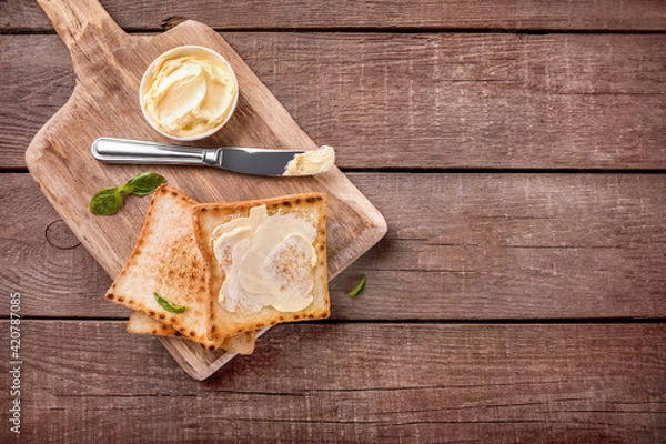 Fototapeta Slices of toast bread with butter