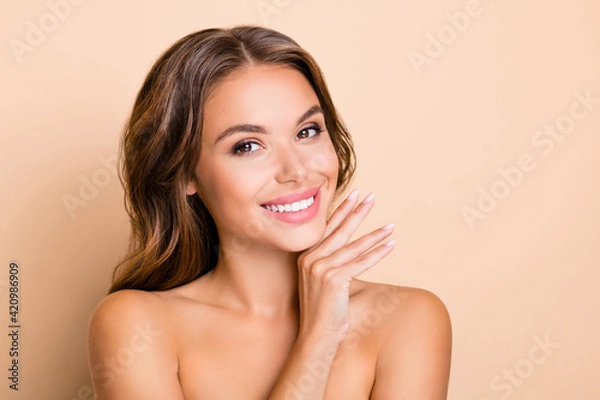 Fototapeta Photo of nice long hairdo optimistic lady without clothes hand face isolated on pastel beige color background