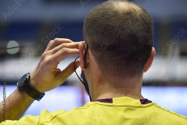 Fototapeta Detail with referee and earphone headset during a handball game