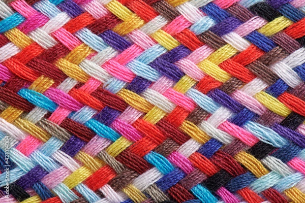 Fototapeta A braid of multi colored sewing threads, macro photography