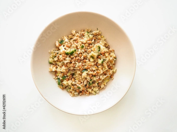 Fototapeta Quinoa and lentils salad in a plate