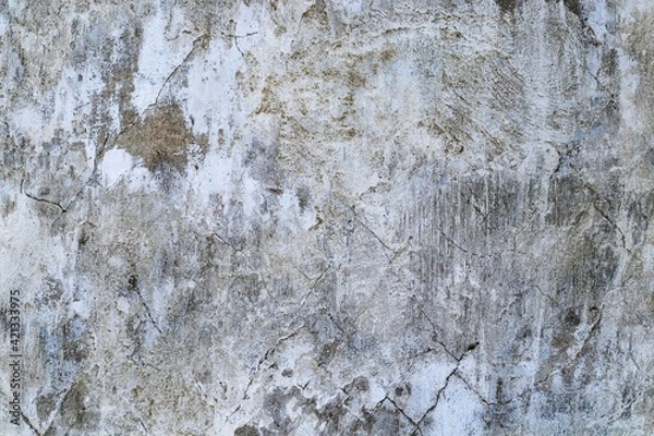 Fototapeta Background texture of an old gray plastered wall with cracks. Traces of old white paint.