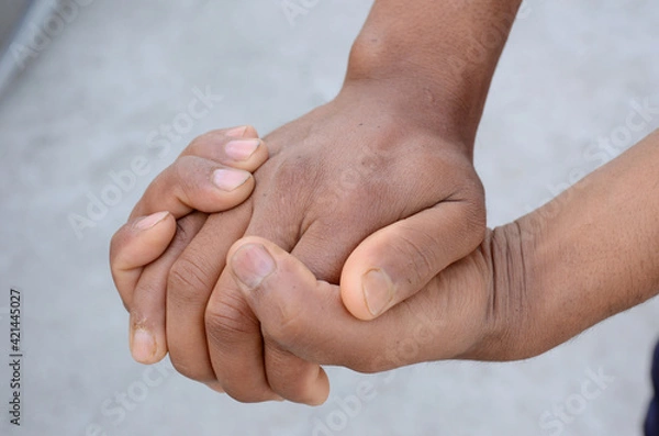 Fototapeta joint hands mental awareness health concept on the grey background.