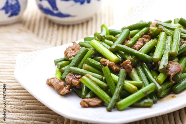 Obraz Stir fried garlic scape and shredded pork