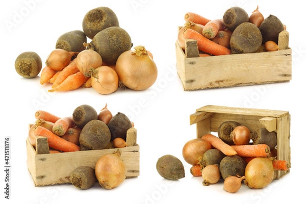 Fototapeta variety of root vegetables in a wooden crate  on a white background