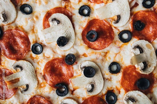 Fototapeta Pizza with olives, tomatoes, mushrooms and cheese. Fast food. 
