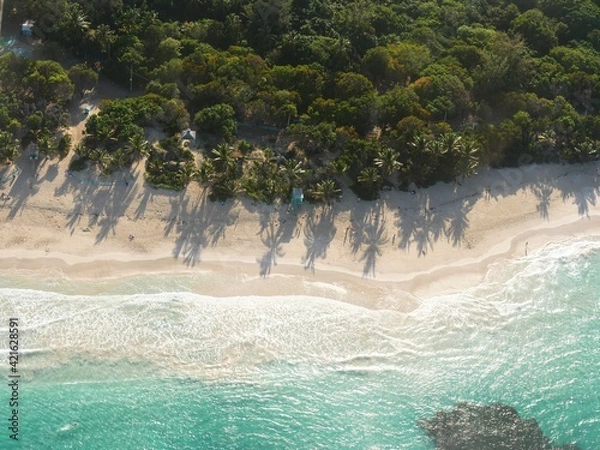 Fototapeta Aerial view of the pristine waters and white sand Flamenco Beach