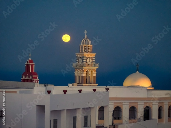 Fototapeta Sundown over Santorini the sun has just set and dusk is falling