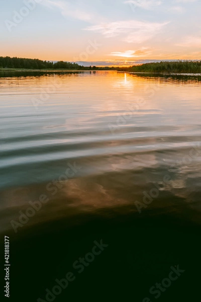 Obraz Sunset over the Lielupe river in Latvia during warm summer evening