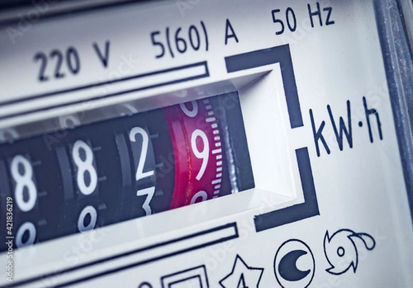 Fototapeta Payment of utility services, concept. Part of an electricity meter, close-up. Selective focus, toned image. 