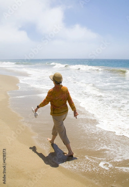 Fototapeta Walking on the beach