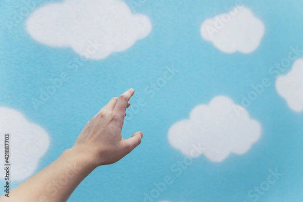 Obraz Hand reaching for the clouds