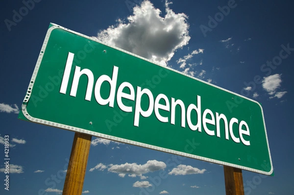 Obraz Independence Road Sign with blue sky and clouds.