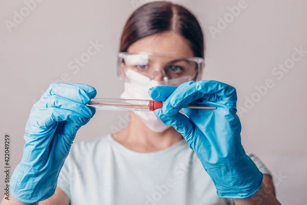 Obraz Lab technician holding test kit for PCR testing virus covid19. Coronavirus COVID-19 swab test kit, PPE protective mask and gloves, tube for taking OP NP patient specimen sample, DNA RNA