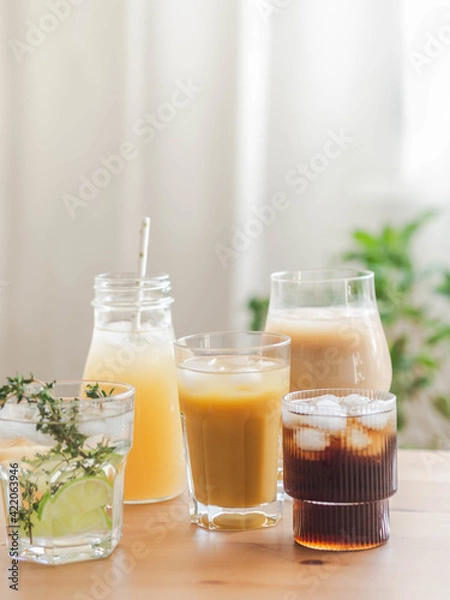 Fototapeta Various refreshing non-alcoholic drinks in glasses with ice.