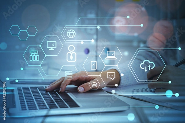 Fototapeta Businesswoman hand on laptop, data symbols and network circuit
