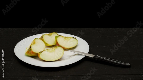 Obraz Cut Apple on a black background on a Table