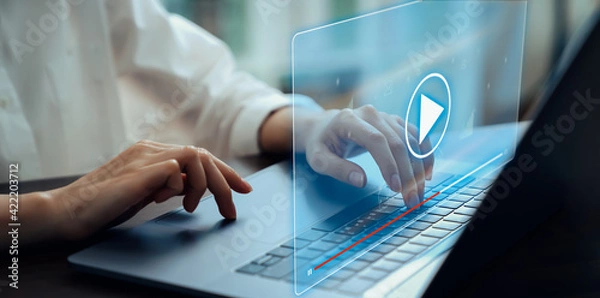 Fototapeta Hand using laptop and press screen to video streaming on internet online. Concept communication network.