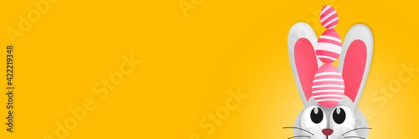 Obraz Cute Easter bunny with Easter eggs on his head. Copy space. Colorful illustration. Banner