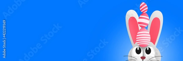 Obraz Cute Easter bunny with Easter eggs on his head. Copy space. Colorful illustration. Banner