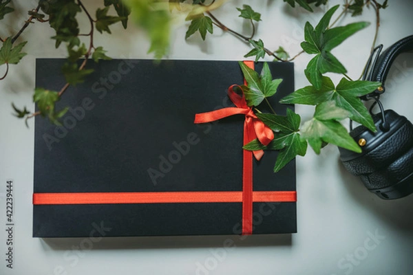 Obraz Black gift box with the red ribbon