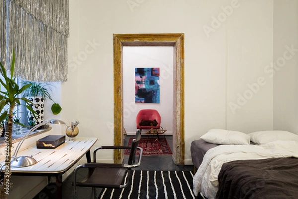Fototapeta Eclectic bedroom with desk