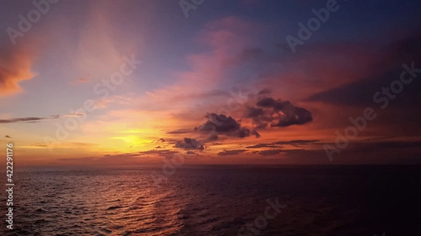 Fototapeta fiery sunset in the sea. when nature paints