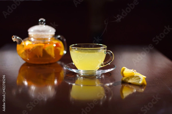 Obraz Hot drink with lemon. Hot tea with lemon. Hot cocktail with lemon.