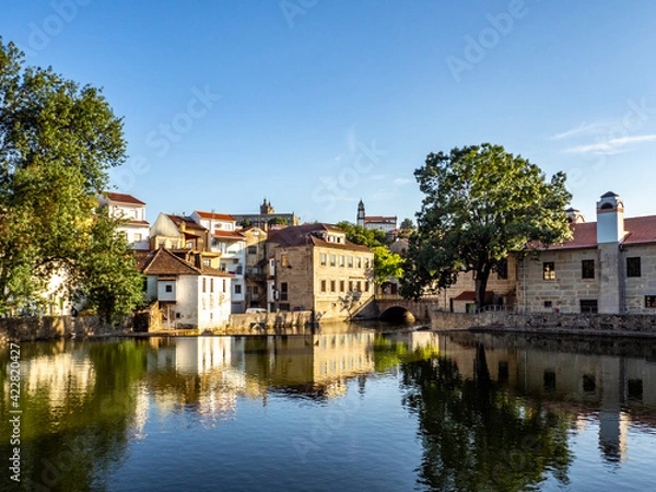 Obraz Old buildings in Viseu reflected on a Pavia river, Portugal