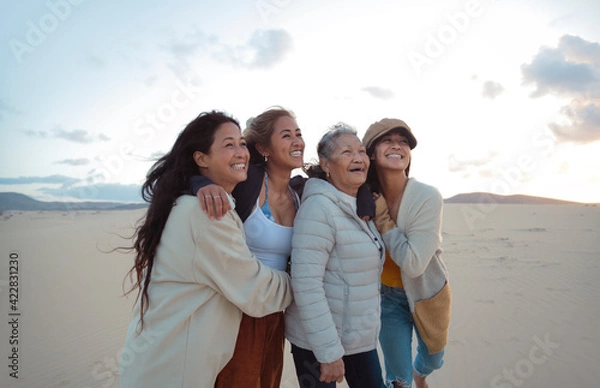 Obraz Family of four filipino women walking and hugging each other in a desert land - Beautiful women of different generations spending time together