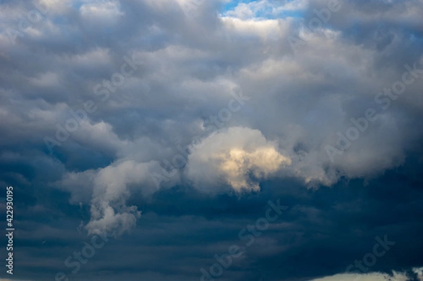 Obraz Cumulus clouds in a blue sky.