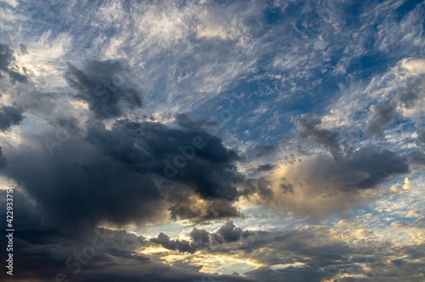 Obraz Cumulus clouds in a blue sky.