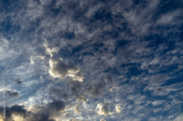 Obraz Cumulus clouds in a blue sky.