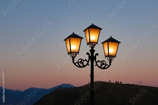 Obraz street lamp at sunset