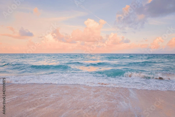 Fototapeta Sea ocean beach sunset sunrise landscape outdoor. Water wave with white foam. Beautiful sunset airy red sky with clouds. Natural aquatic blue pink turquoise aquamarine colorful background.