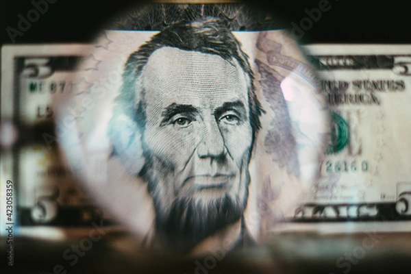 Obraz Five dollar bill seen through a magnifying glass