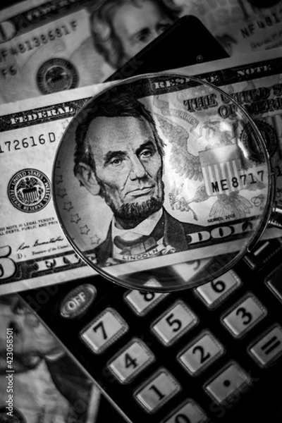 Obraz Five dollar bill with a magnifying glass and calculator
