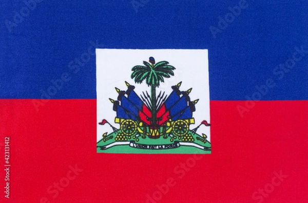 Fototapeta national flag of the Republic of Haiti on a fabric base close-up