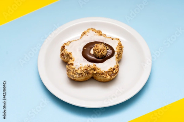 Obraz  Donut on blue and  yellow background