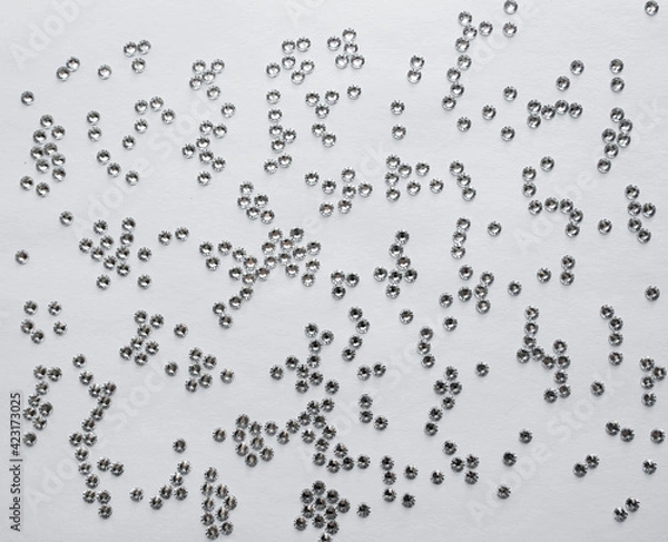 Obraz rhinestones on a gray background, top photo